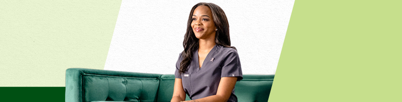 Smiling Rasmussen graduate in grey scrubs sitting on green couch
