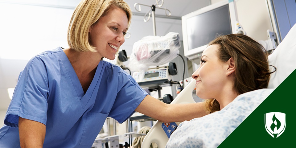 photo of a healthcare worker comforting a patient in a bed