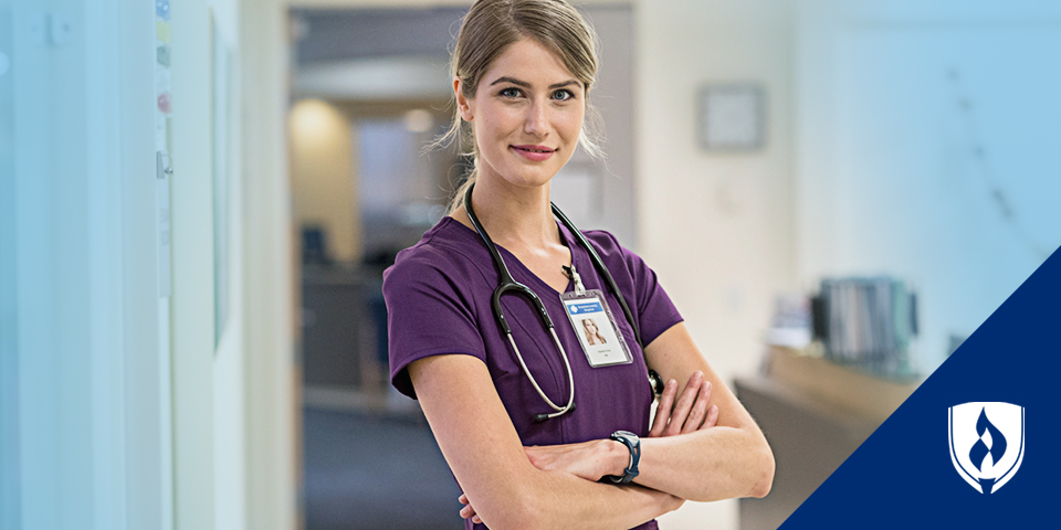 Female nurse standing with arms crossed