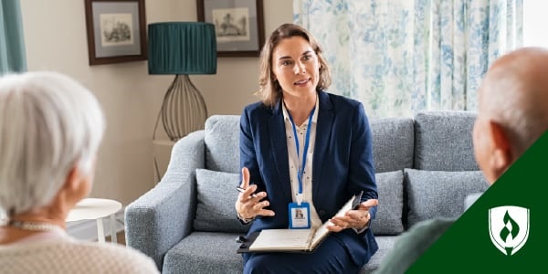 photo of a nursing home administrator speaking with potiental residents representing what does a nursing home administrator do