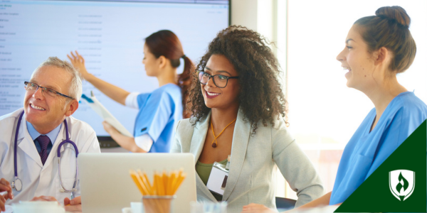 a healthcare manager meets with a team of care providers