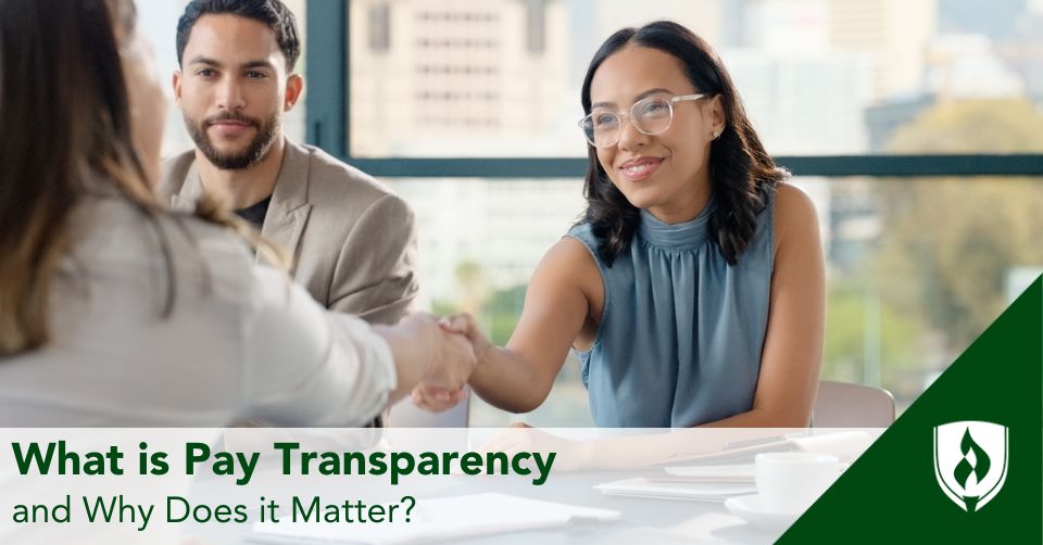 An HR representative shakes hands with a job applicant