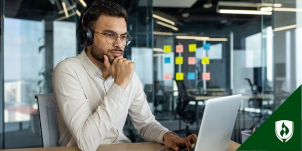 A marketing major works on his computer in a marketing office