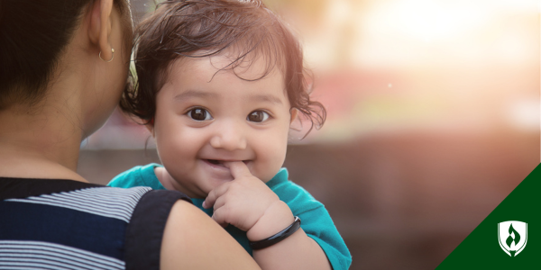 An adorable infant smiles at the camera