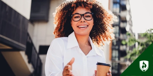 An early childhood educator reaches out a hand to introduce herself