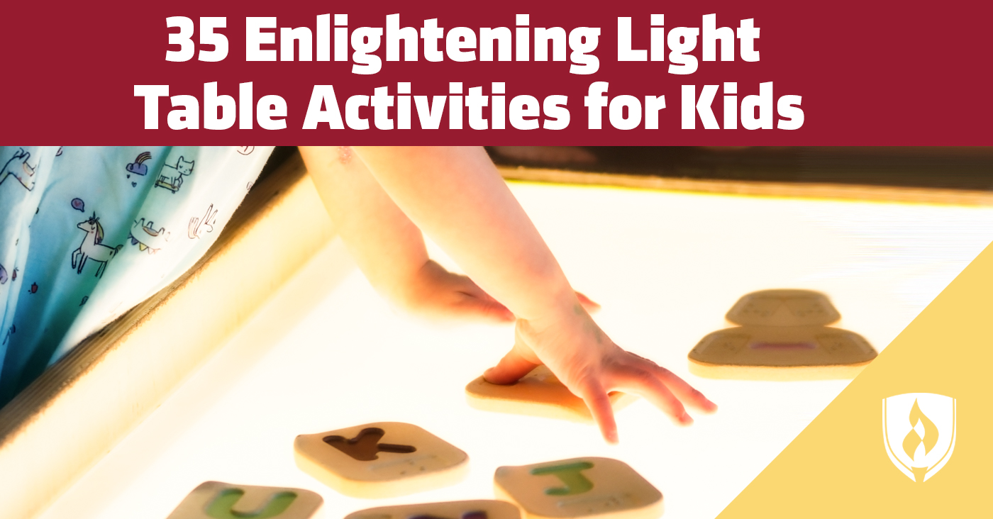 Child playing with alphabet blocks on a light table