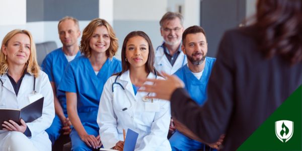 A healthcare team listens to a presentation