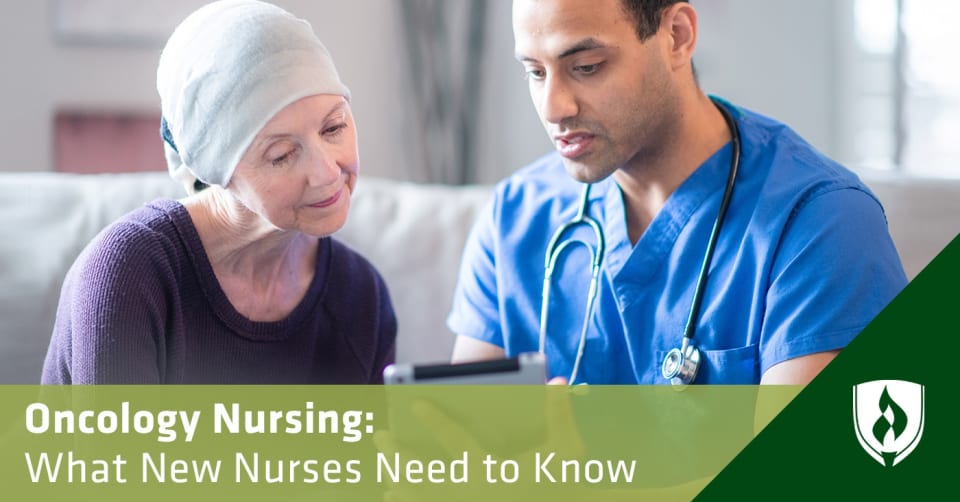 Photo of an oncology nurse helping a patient read information on a tablet