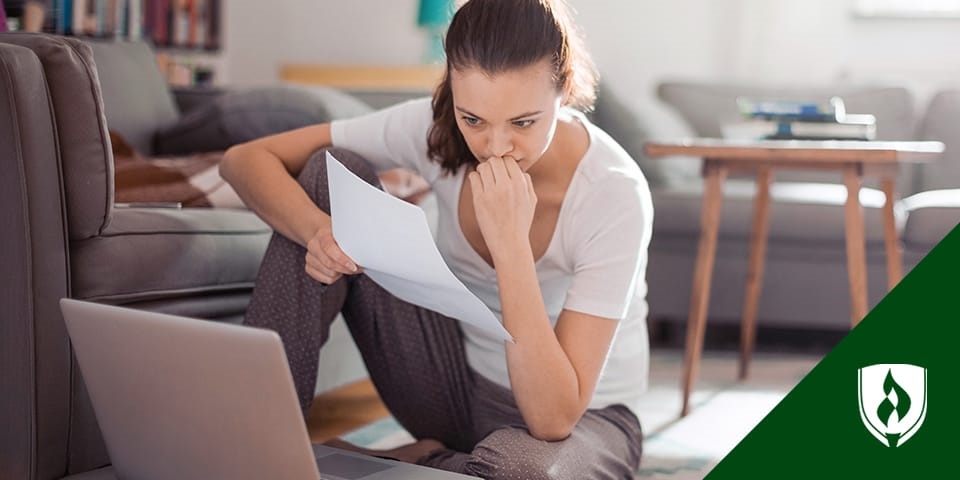 female studying for the TEAS test with a paper in her hand