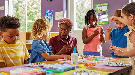 female childhood education teacher and young children