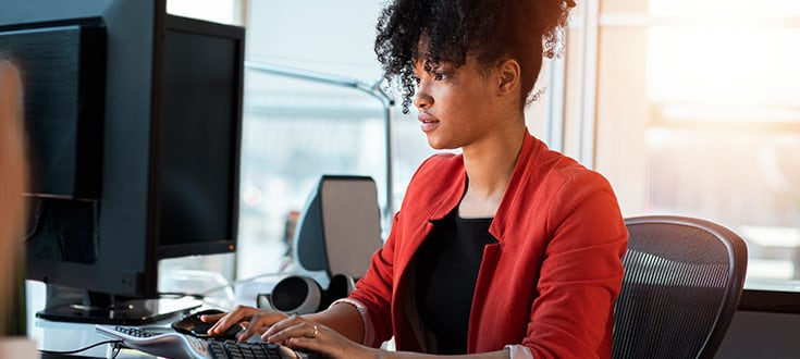 Female working at computer HIT 1