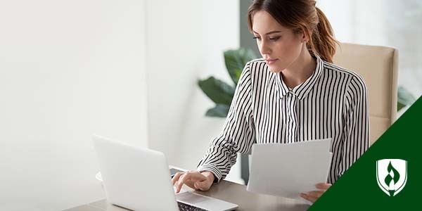 photo of a corporate paralegal working at a desk